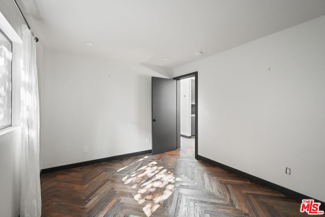 21273 Entrada Road Topanga, CA 90290 - Photo 44 of 70 a view of a room with wooden floor and a window