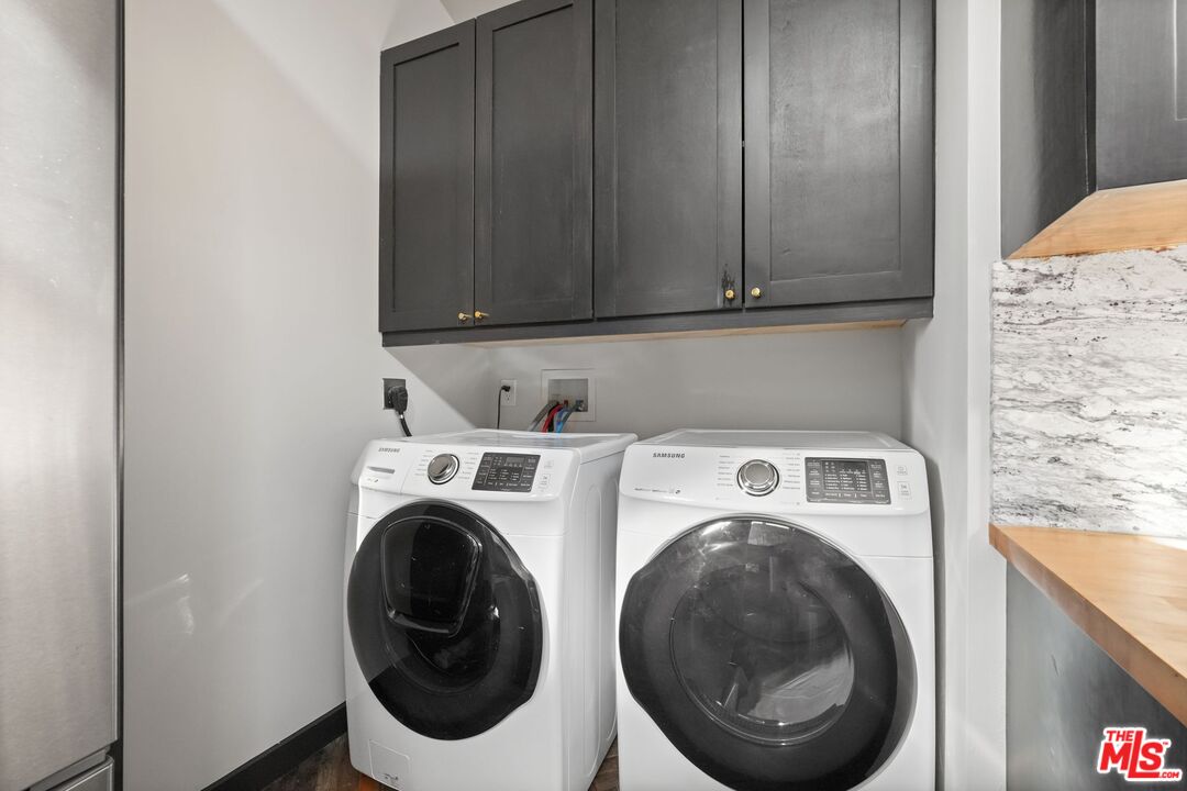 21273 Entrada Road Topanga, CA 90290 - Photo 51 of 70 a utility room with dryer and washer
