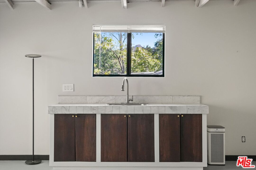 21273 Entrada Road Topanga, CA 90290 - Photo 61 of 70 a kitchen with a granite countertop sink and window