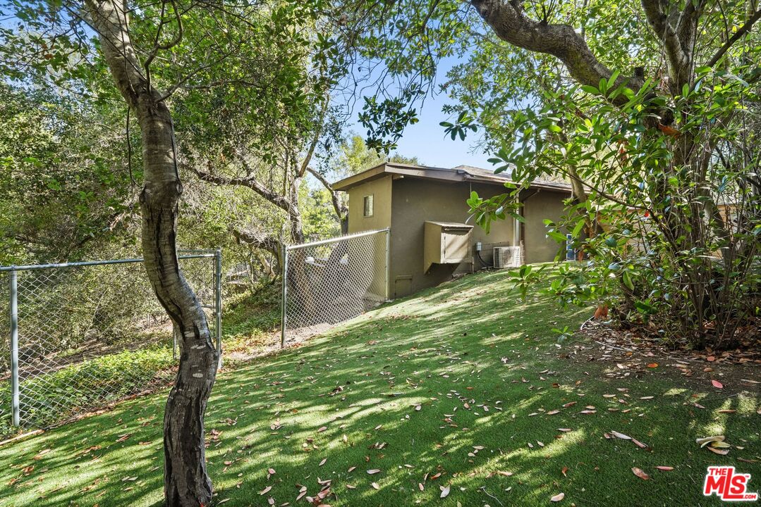 21273 Entrada Road Topanga, CA 90290 - Photo 64 of 70 a yellow house in middle of the forest