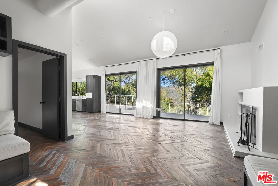 21273 Entrada Road Topanga, CA 90290 - Photo 9 of 70 a view of a livingroom with furniture wooden floor and window