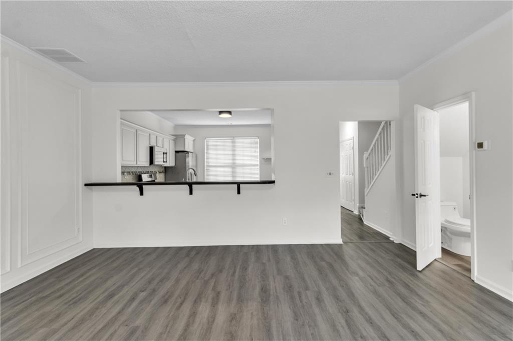 9155 Nesbit Ferry Road, Unit 96 Alpharetta, GA 30022 - Photo 12 of 46 a view of empty room with wooden floor