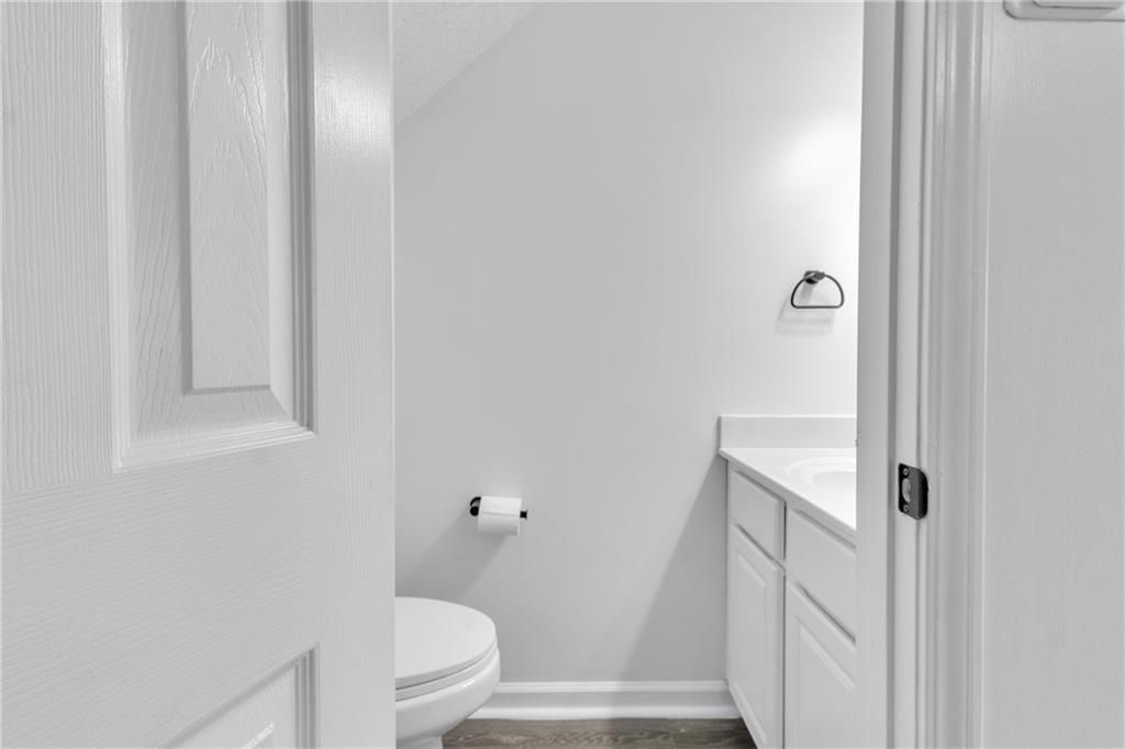 9155 Nesbit Ferry Road, Unit 96 Alpharetta, GA 30022 - Photo 13 of 46 a bathroom with a sink a toilet and shower