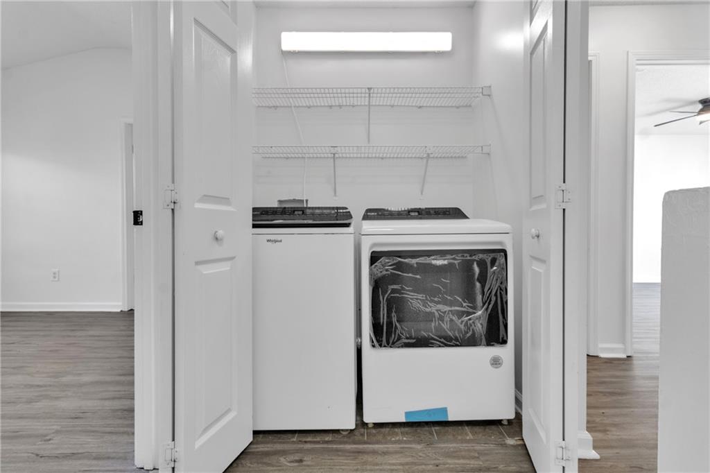9155 Nesbit Ferry Road, Unit 96 Alpharetta, GA 30022 - Photo 16 of 46 a utility room with washer and dryer
