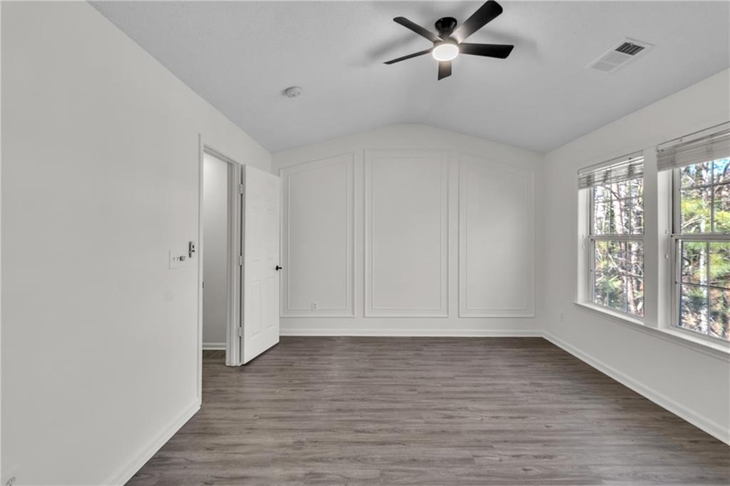 9155 Nesbit Ferry Road, Unit 96 Alpharetta, GA 30022 - Photo 19 of 46 a view of empty room with wooden floor and fan