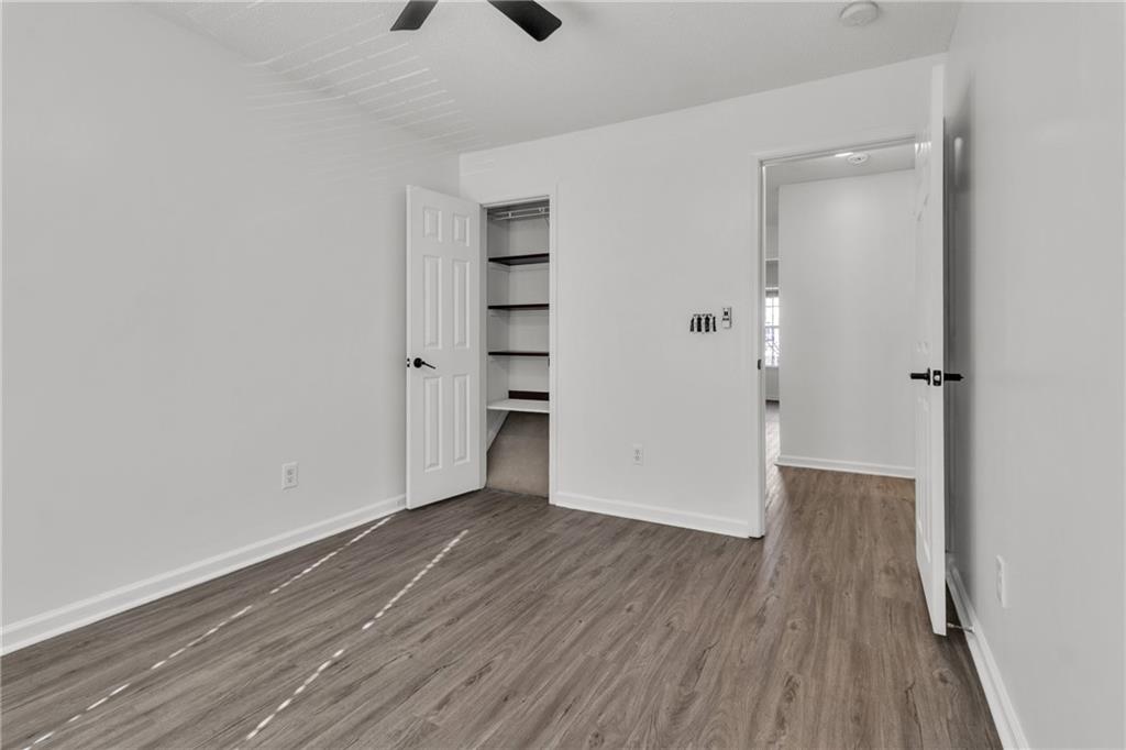 9155 Nesbit Ferry Road, Unit 96 Alpharetta, GA 30022 - Photo 29 of 46 a view of empty room with wooden floor