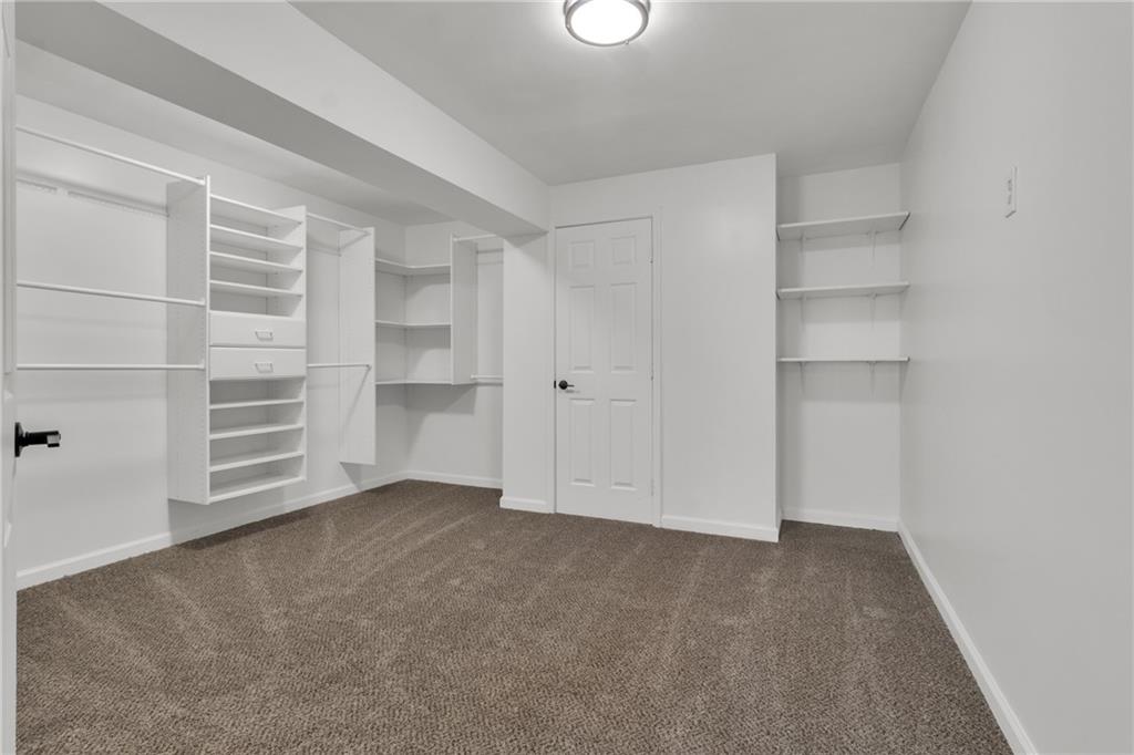 9155 Nesbit Ferry Road, Unit 96 Alpharetta, GA 30022 - Photo 35 of 46 a view of an empty room with a closet