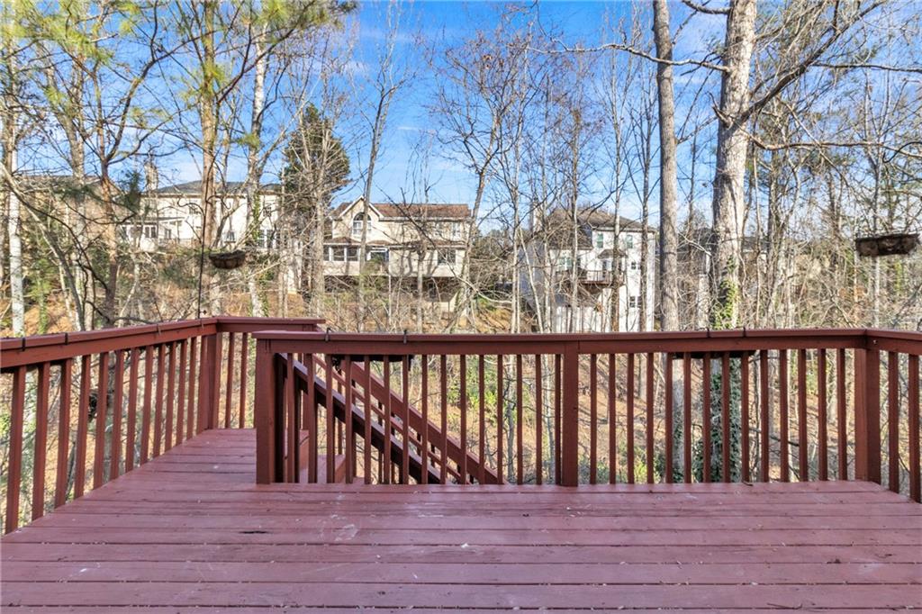 9155 Nesbit Ferry Road, Unit 96 Alpharetta, GA 30022 - Photo 38 of 46 a view of balcony with wooden floor and fence
