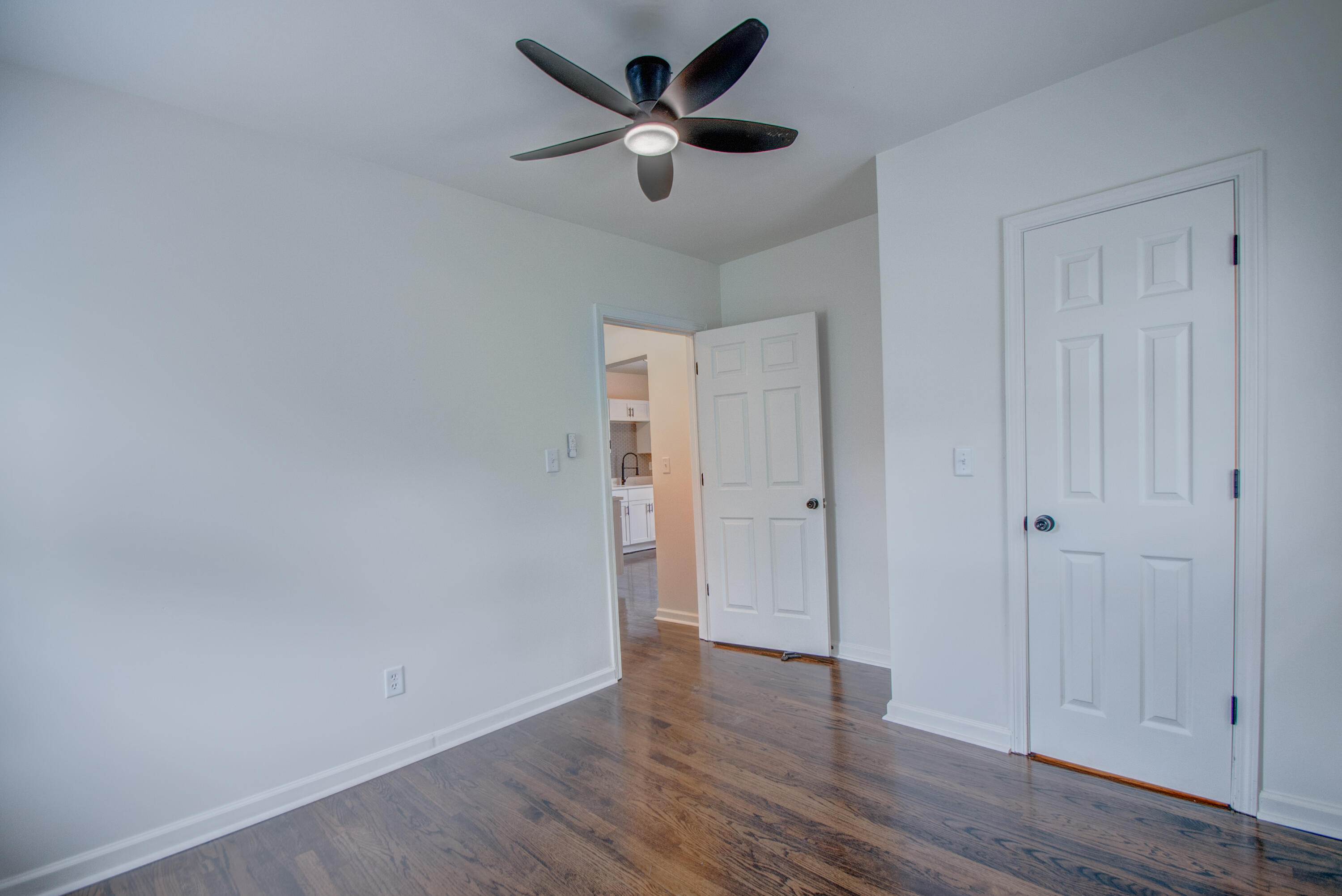 613 Tennessee Street Gary, IN 46402 - Photo 9 of 39 a view of an empty room and wooden floor