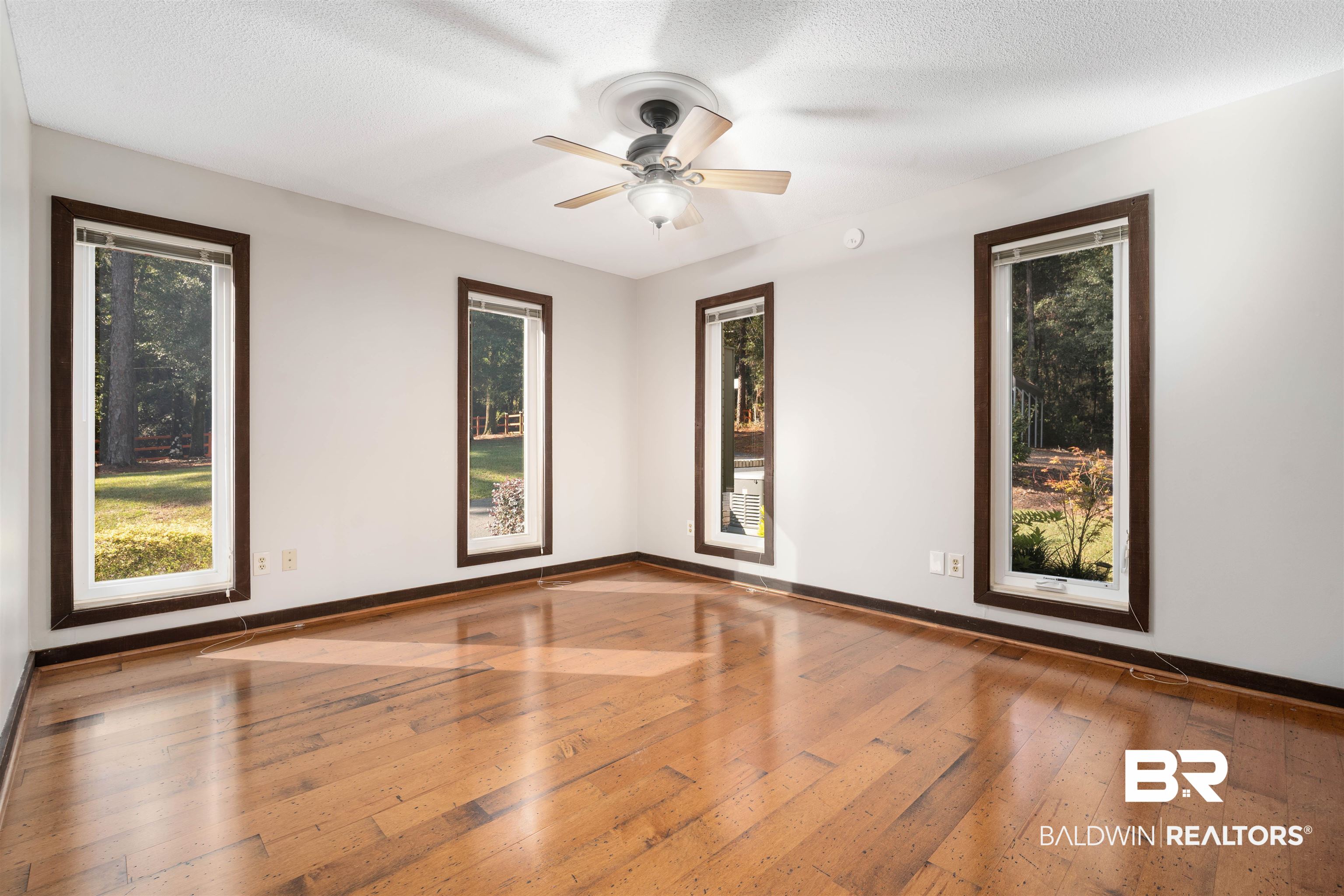 7912 Yorkhaven Road Mobile, AL 36695 - Photo 25 of 41 Unfurnished room with light wood-style flooring, a textured ceiling, and ceiling fan