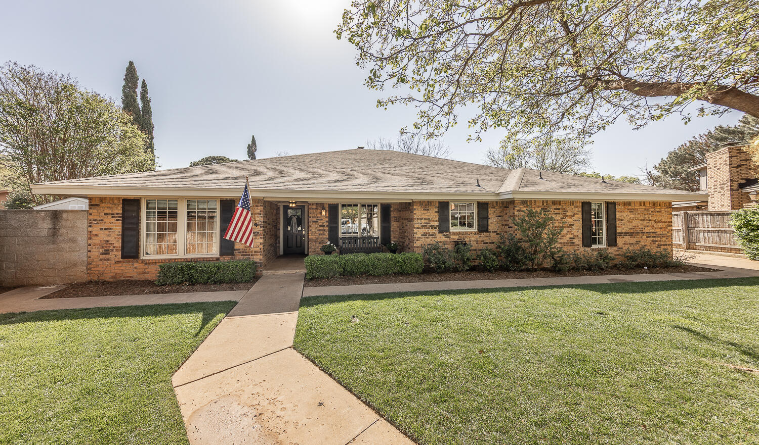4411 88th Street Lubbock, TX 79424 - Photo 1 of 38 front view of a house and a yard