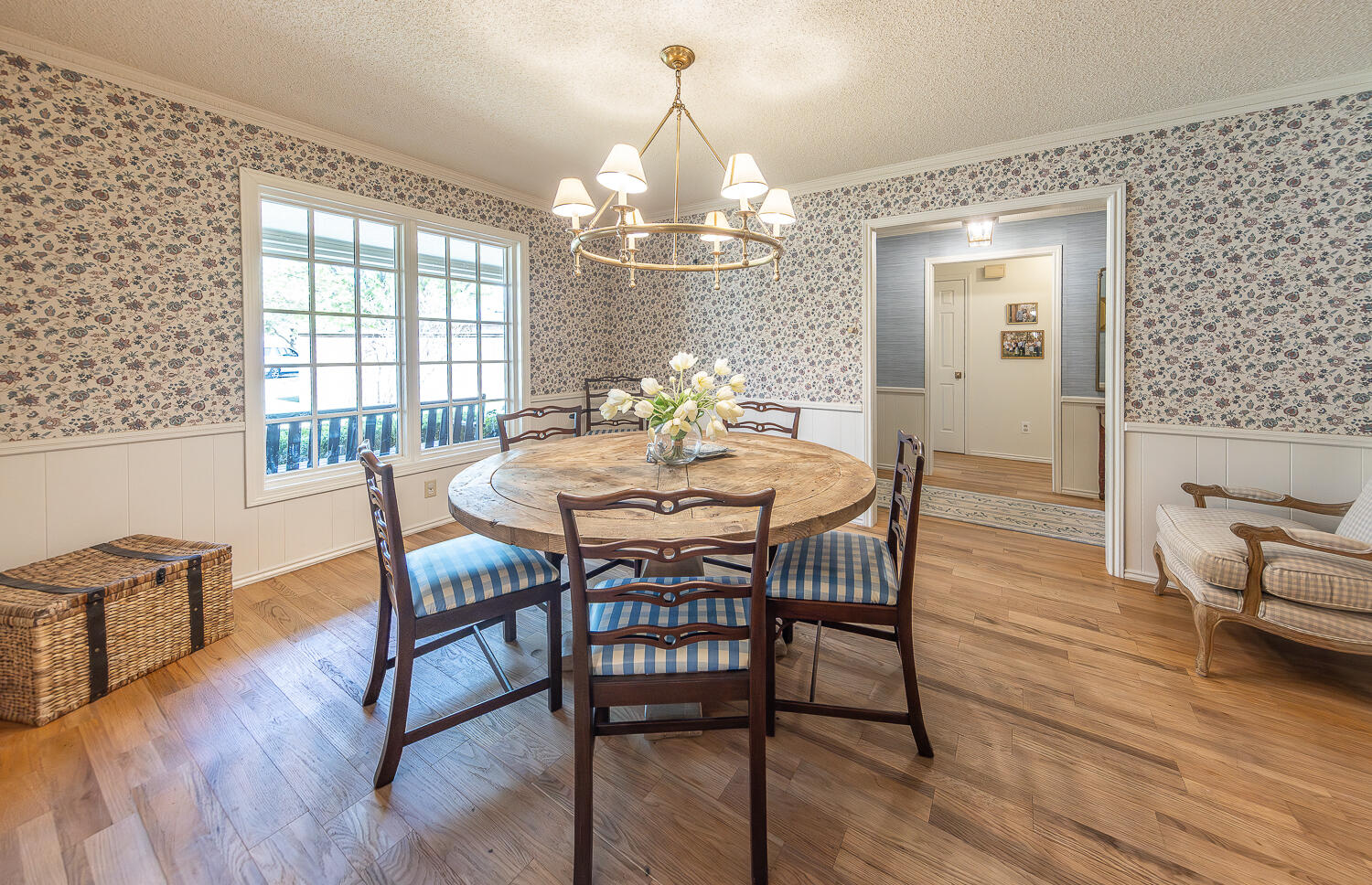 4411 88th Street Lubbock, TX 79424 - Photo 11 of 38 a view of a dining room with furniture window and wooden floor