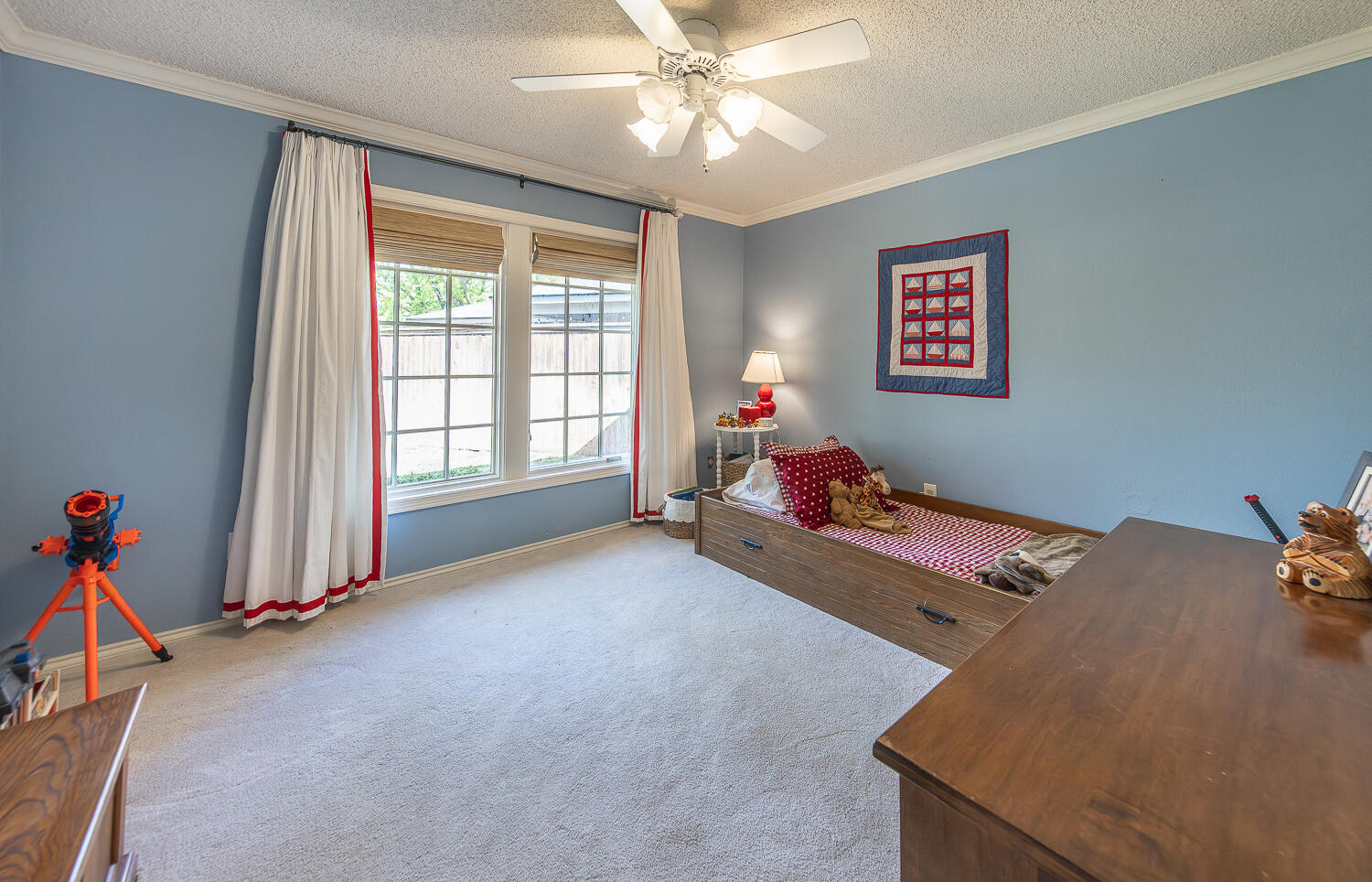 4411 88th Street Lubbock, TX 79424 - Photo 20 of 38 a bed room with furniture and a window