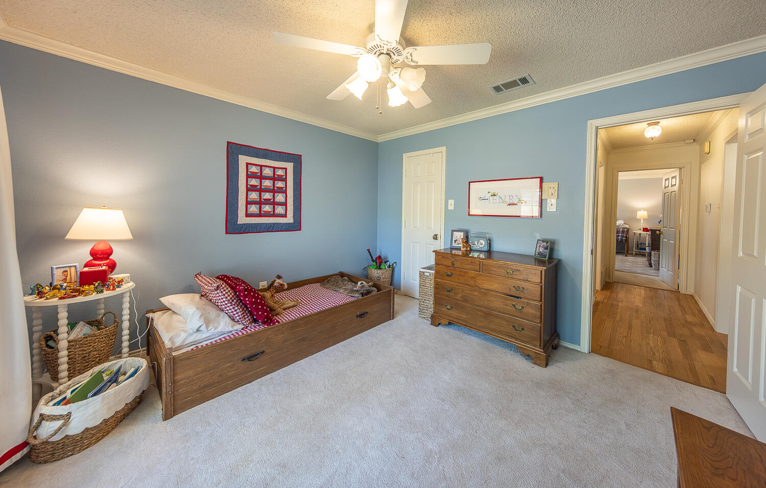 4411 88th Street Lubbock, TX 79424 - Photo 21 of 38 a living room with furniture and a baby crib