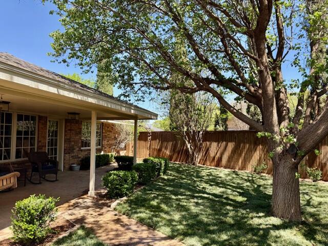4411 88th Street Lubbock, TX 79424 - Photo 33 of 38 a front view of a house with garden