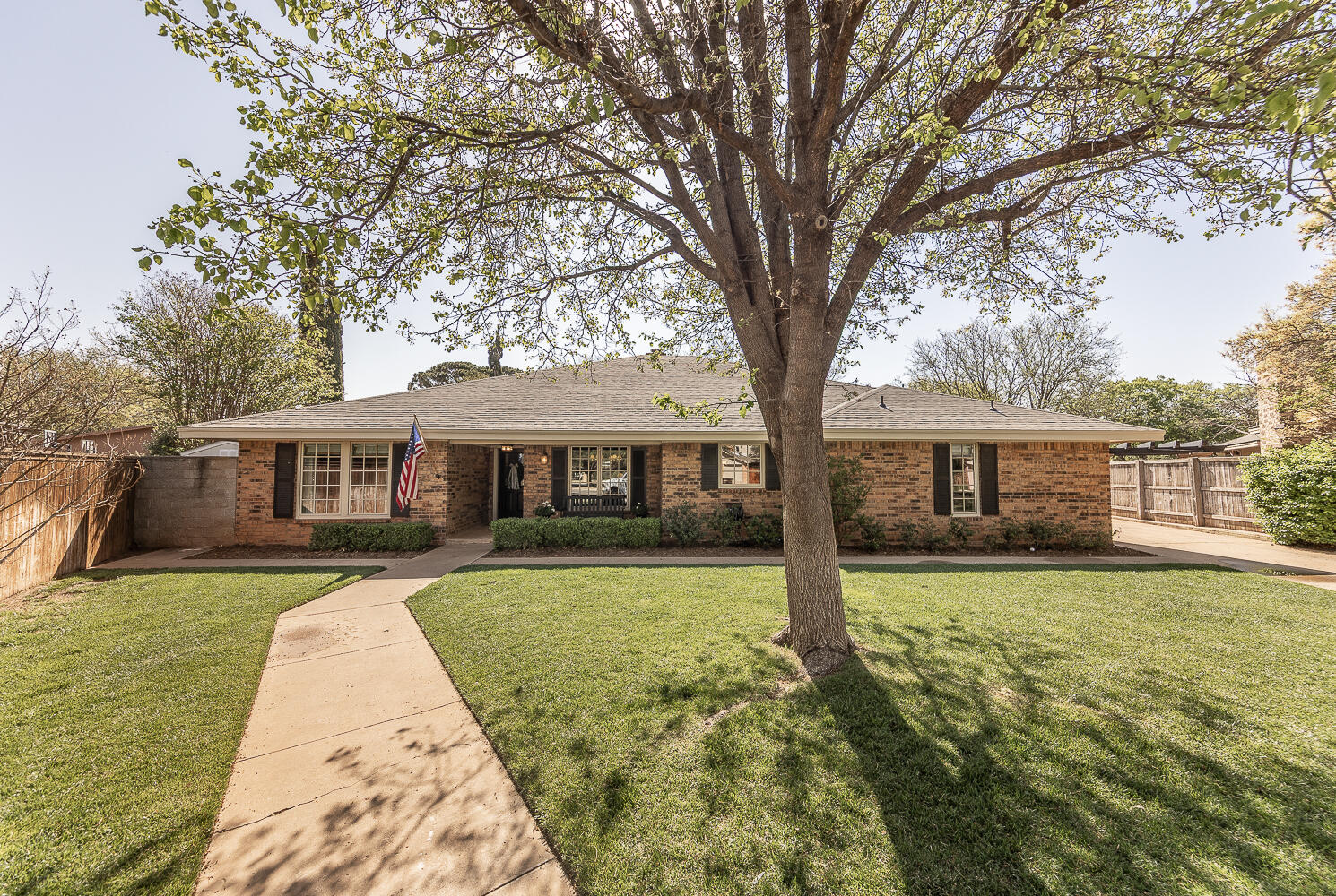 4411 88th Street Lubbock, TX 79424 - Photo 35 of 38 a front view of a house with garden