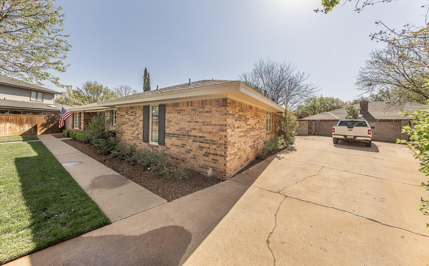 4411 88th Street Lubbock, TX 79424 - Photo 37 of 38 a front view of a house with a yard