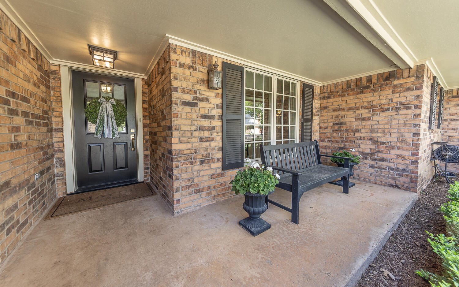 4411 88th Street Lubbock, TX 79424 - Photo 38 of 38 a view of an entryway with a bench in patio