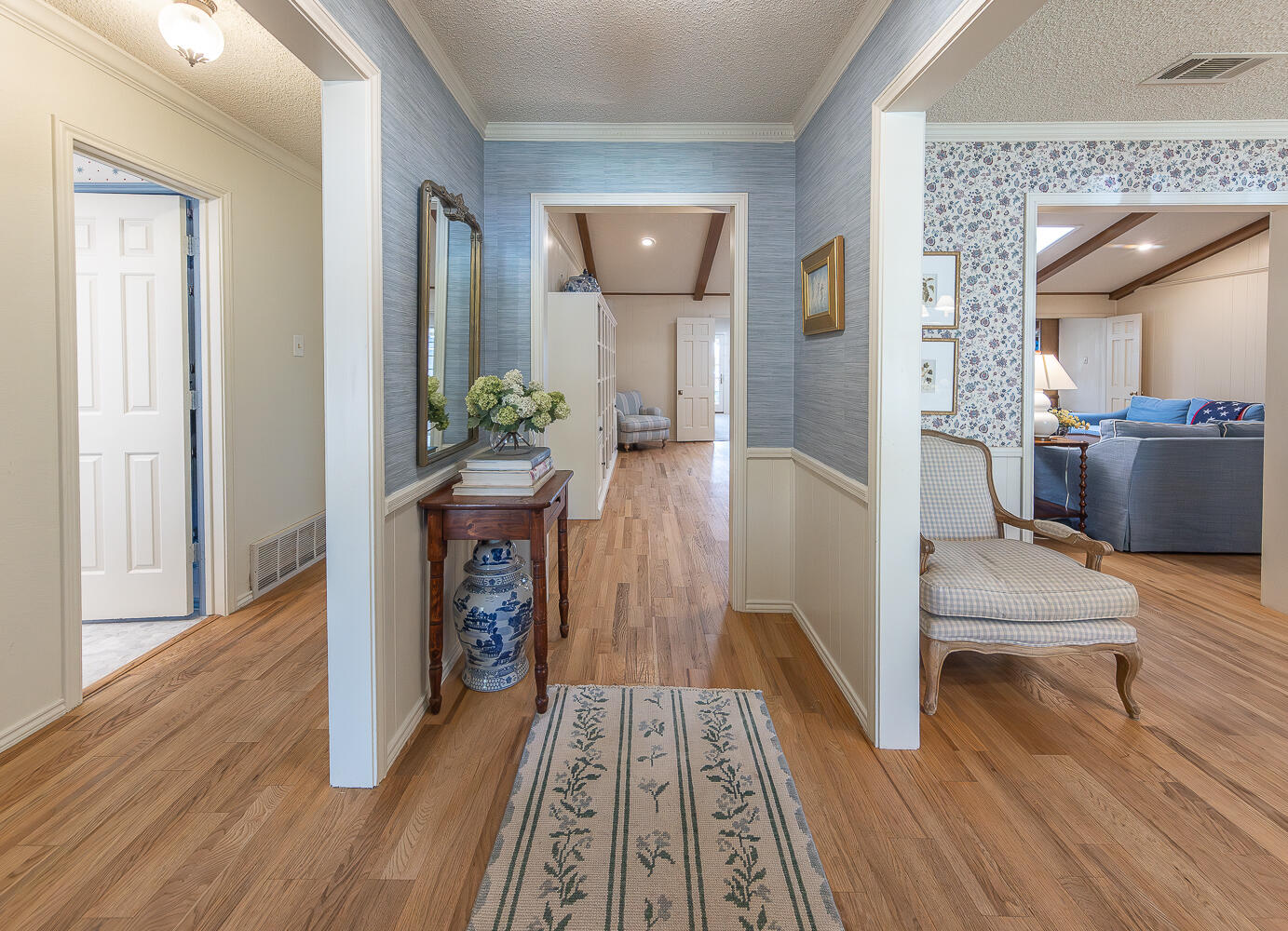 4411 88th Street Lubbock, TX 79424 - Photo 8 of 38 a view of a hallway view with wooden floor and staircase