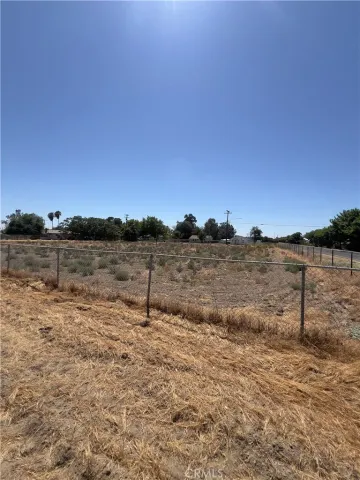 a view of a lake with beach in background