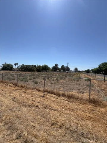 a view of a lake with beach in background