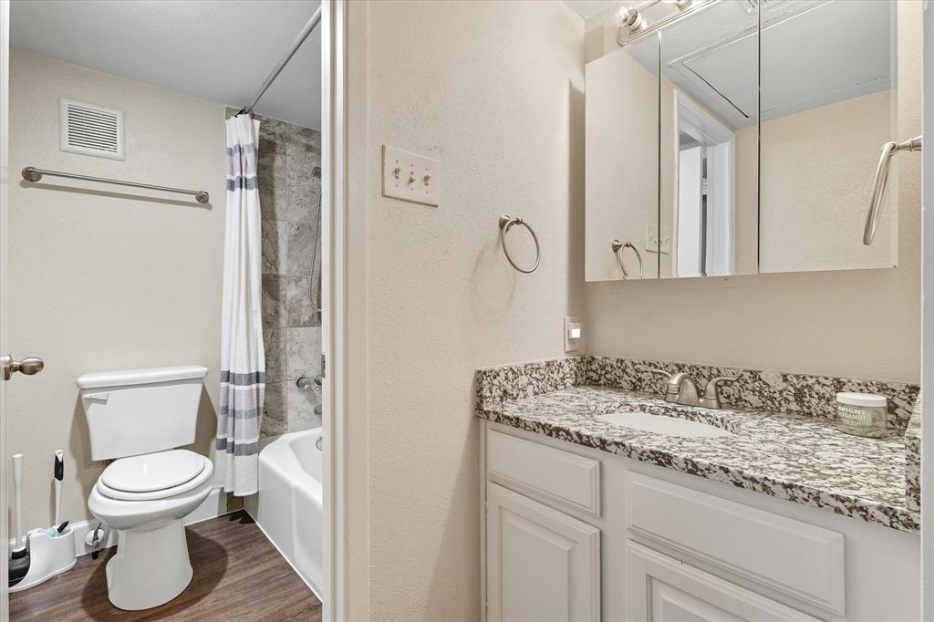 4539 North O'Connor Road, Unit 2234 Irving, TX 75062 - Photo 11 of 20 a bathroom with a granite countertop sink toilet and shower