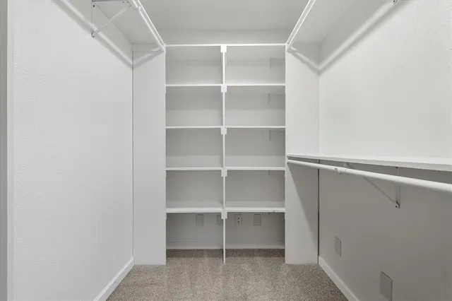 a view of an empty walk in closet