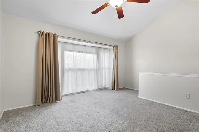 an empty room with a empty space and windows