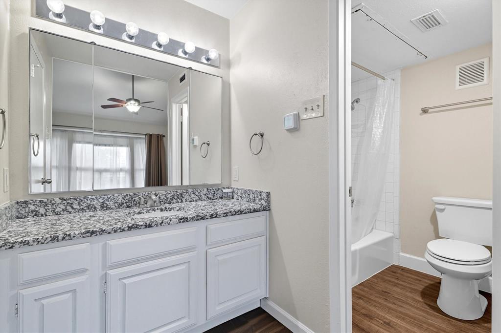 4539 North O'Connor Road, Unit 2234 Irving, TX 75062 - Photo 19 of 20 a bathroom with a granite countertop sink toilet and shower