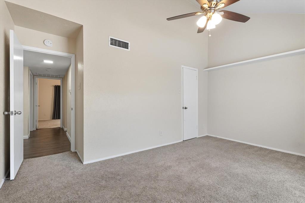 4539 North O'Connor Road, Unit 2234 Irving, TX 75062 - Photo 9 of 20 an empty room with a chandelier fan and windows