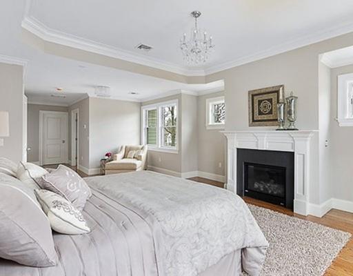 1 Aaron Road Lexington, MA 02421 - Photo 20 of 27 a spacious bedroom with a bed and a fireplace