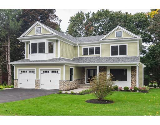 1 Aaron Road Lexington, MA 02421 - Photo 2 of 27 a front view of a house with a yard and garage