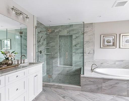 1 Aaron Road Lexington, MA 02421 - Photo 21 of 27 a spacious bathroom with a double vanity sink a shower and a mirror