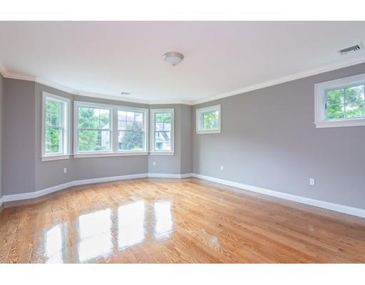 1 Aaron Road Lexington, MA 02421 - Photo 23 of 27 a view of an empty room with wooden floor and a window