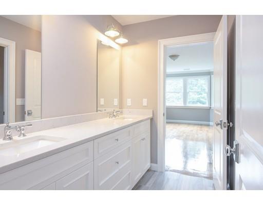 1 Aaron Road Lexington, MA 02421 - Photo 24 of 27 a bathroom with a sink vanity granite and a mirror