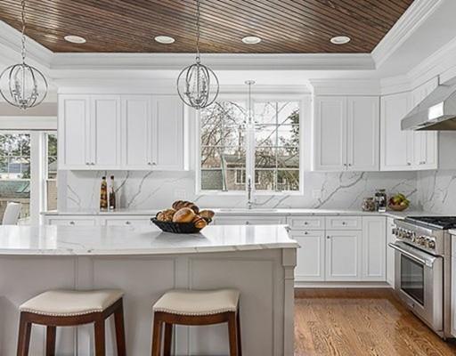1 Aaron Road Lexington, MA 02421 - Photo 10 of 27 a kitchen with stainless steel appliances a table chairs and a window