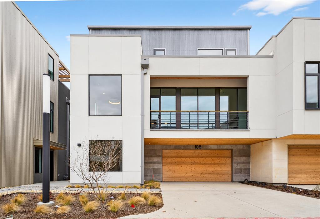 a front view of a house with a garage
