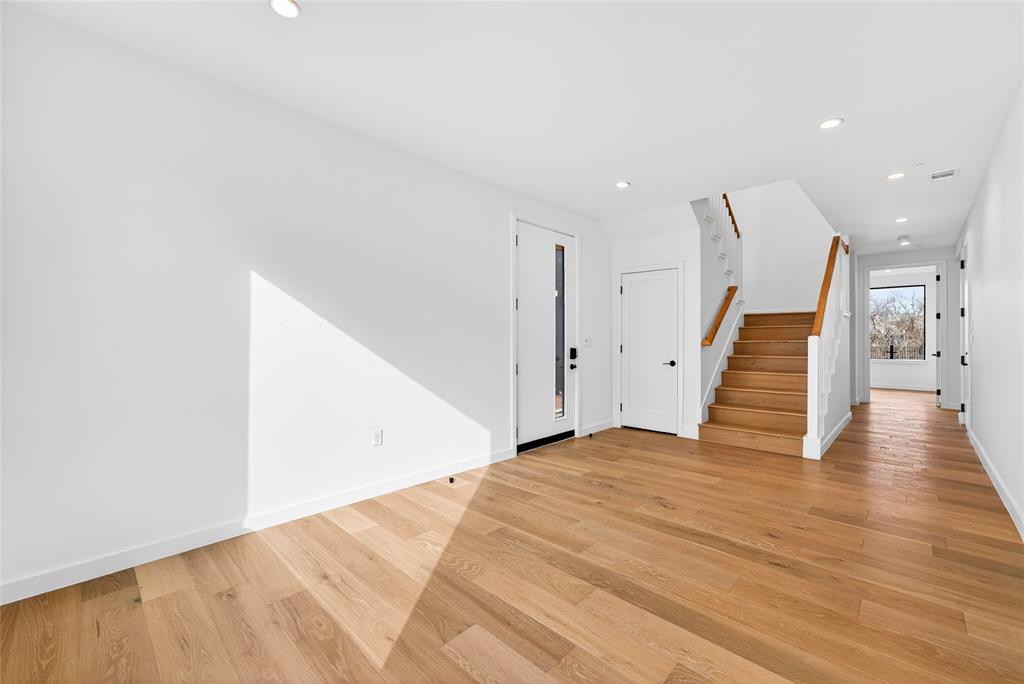1111 Raiford Road, Unit 108 Carrollton, TX 75007 - Photo 16 of 39 a view of an empty room with wooden floor