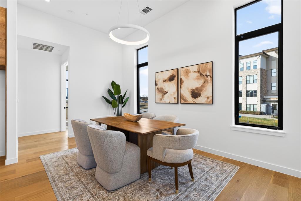 1111 Raiford Road, Unit 108 Carrollton, TX 75007 - Photo 10 of 39 a dining room with furniture and wooden floor