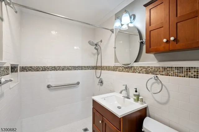 a bathroom with a sink and mirror