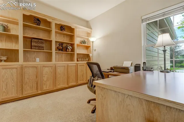 a view of a workspace with furniture