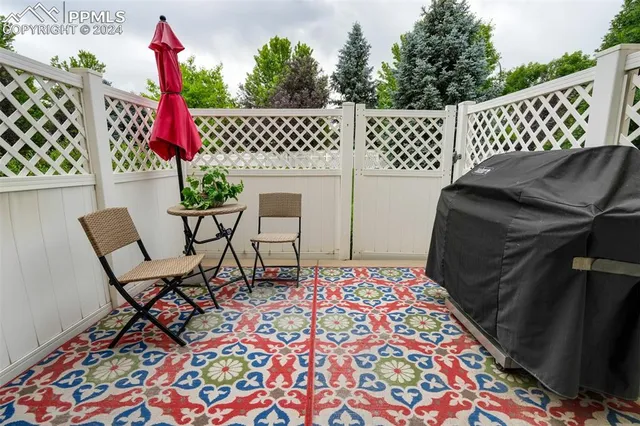 a balcony with a couch and a table