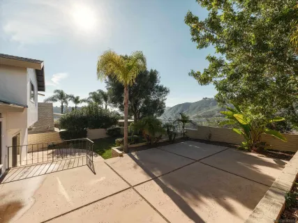 a view of backyard with sitting area