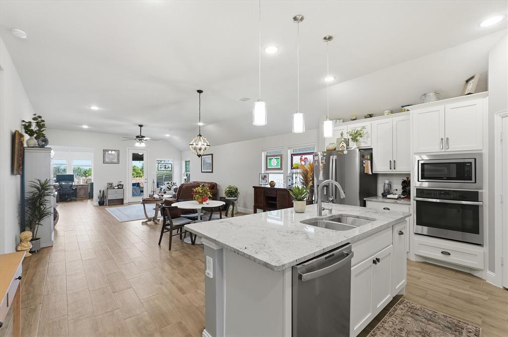 813 Mildren Lane Fate, TX 75087 - Photo 31 of 32 Gorgeous view of the open floorplan as you step into the entry!