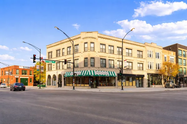 a view of a building with a street
