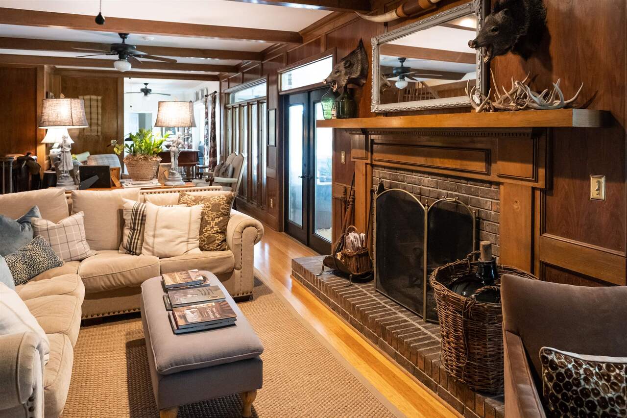 183 Madden Road Bowdon, GA 30108 - Photo 11 of 79 a living room with furniture and a fireplace