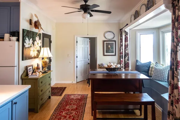 a kitchen with a sink a window and cabinets