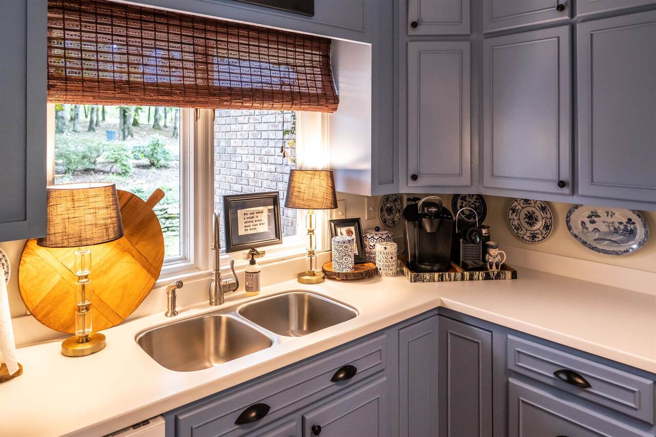 183 Madden Road Bowdon, GA 30108 - Photo 17 of 79 a kitchen with a sink and a window