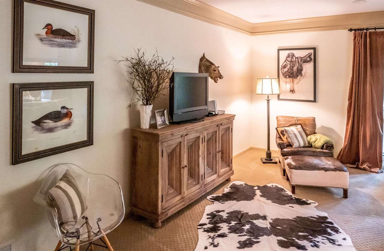 183 Madden Road Bowdon, GA 30108 - Photo 22 of 79 a living room with furniture and a flat screen tv