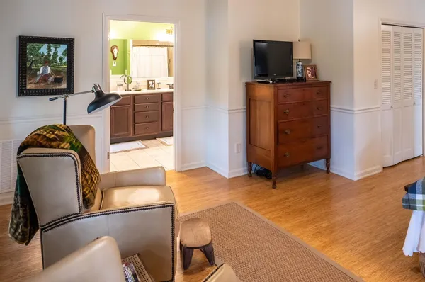 a kitchen with stainless steel appliances kitchen island granite countertop a refrigerator and cabinets